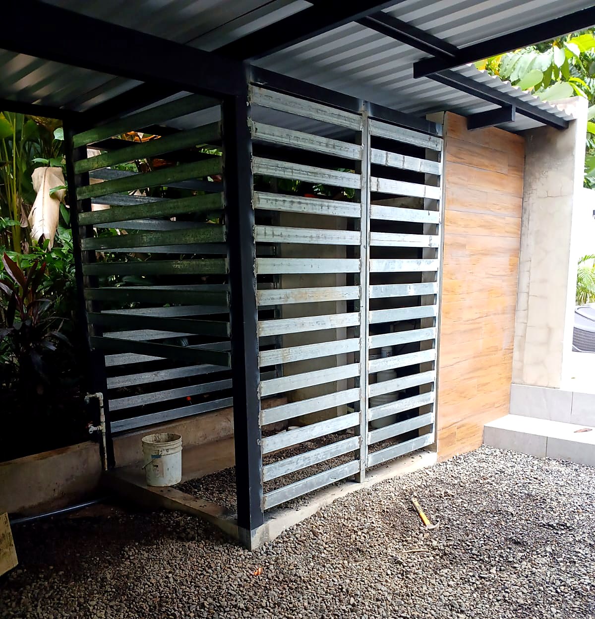 Steel carport & louvered screen