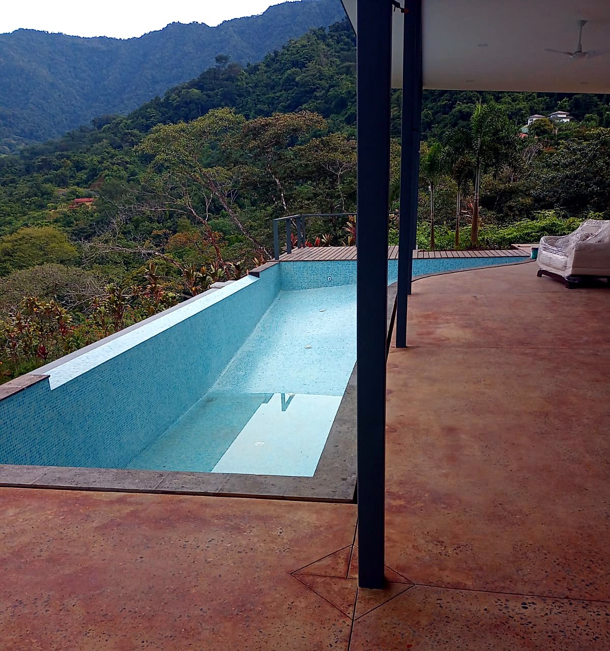Infinity-edge pool with jungle view