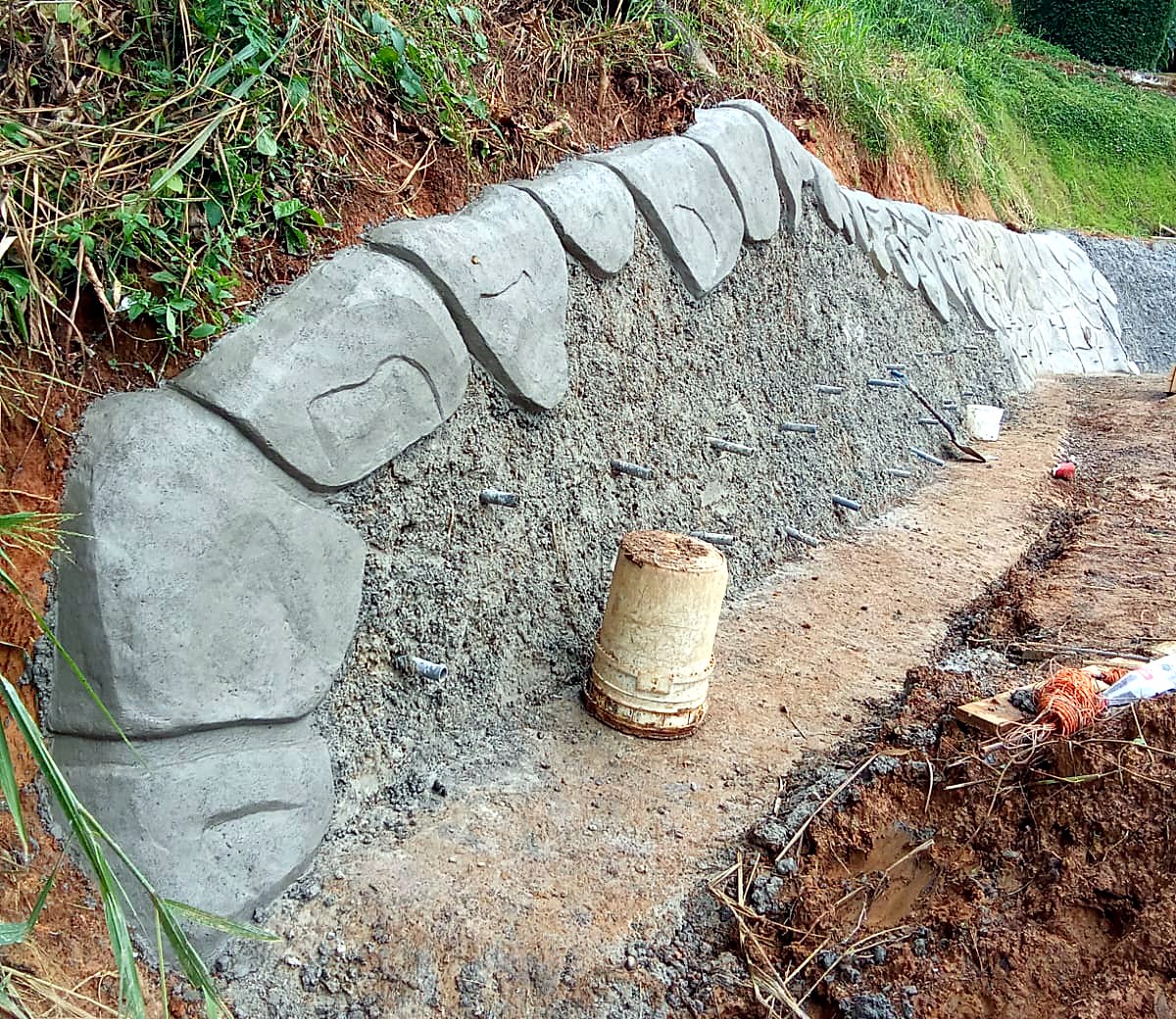 Hand-sculpted stone-pattern wall in progress